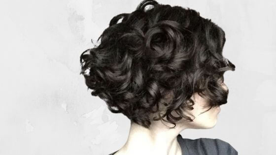 Asymmetrical pixie cut curly hair