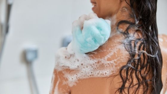 woman using body wash